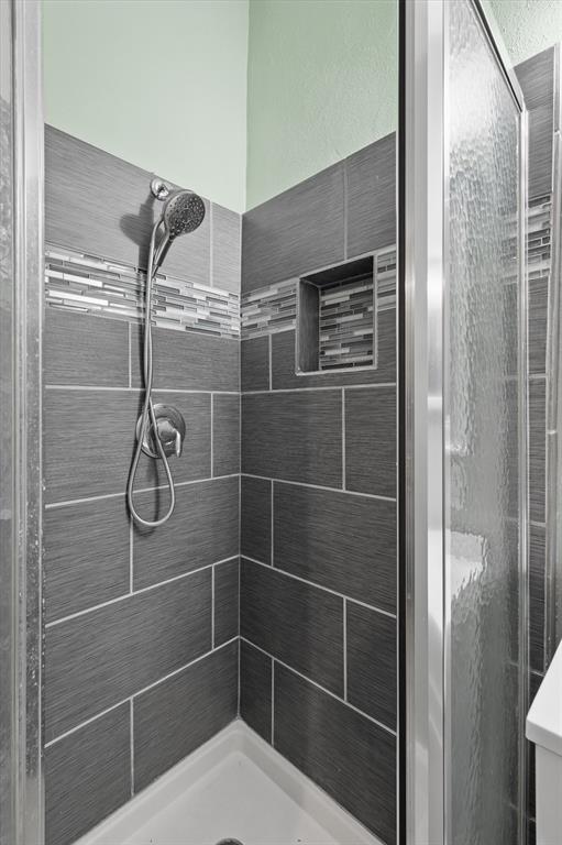 12824 Midway Road, Unit 2136 Dallas, TX 75244 - Photo 25 of 40 a bathroom with a shower