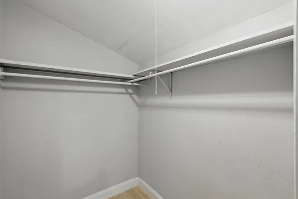 a view of a room with shelf on the wall