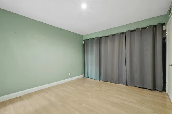 a view of wooden floor and staircase in a room