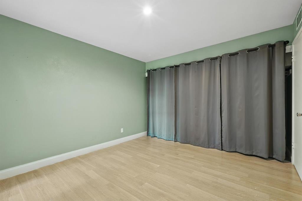 12824 Midway Road, Unit 2136 Dallas, TX 75244 - Photo 29 of 40 a view of wooden floor and staircase in a room