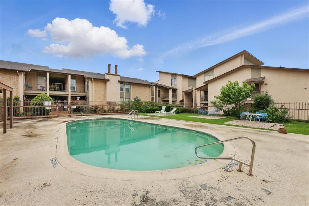 12824 Midway Road, Unit 2136 Dallas, TX 75244 - Photo 36 of 40 a view of a house with swimming pool