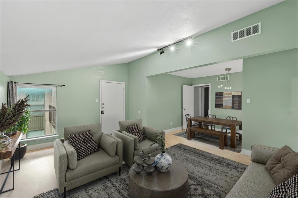 12824 Midway Road, Unit 2136 Dallas, TX 75244 - Photo 4 of 40 a living room with furniture and wooden floor