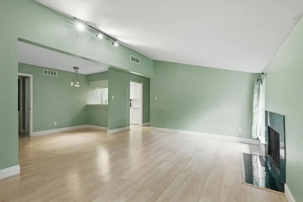 a view of a livingroom with wooden floor