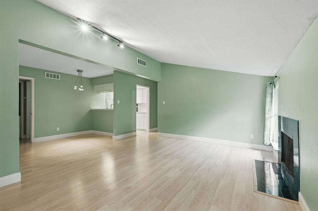 12824 Midway Road, Unit 2136 Dallas, TX 75244 - Photo 7 of 40 a view of a livingroom with wooden floor