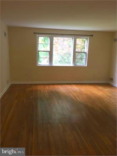 5319 Pooks Hill Road, Unit 1 Bethesda, MD 20814 - Photo 9 of 18 an empty room with windows