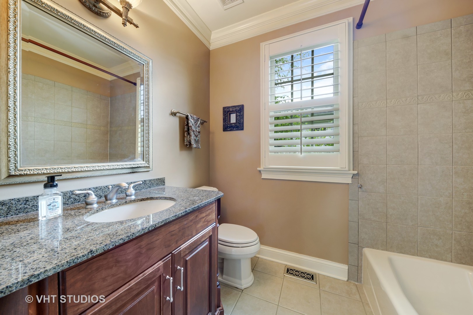 1839 Driving Park Road Wheaton, IL 60187 - Photo 12 of 16 a bathroom with a granite countertop sink toilet and shower