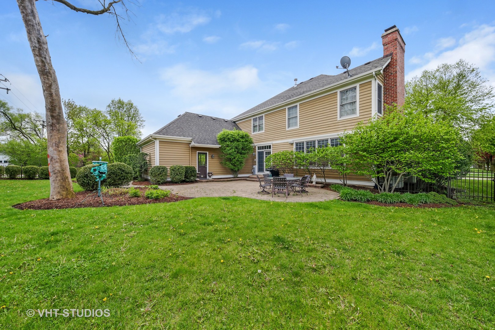 1839 Driving Park Road Wheaton, IL 60187 - Photo 16 of 16 a front view of a house with garden
