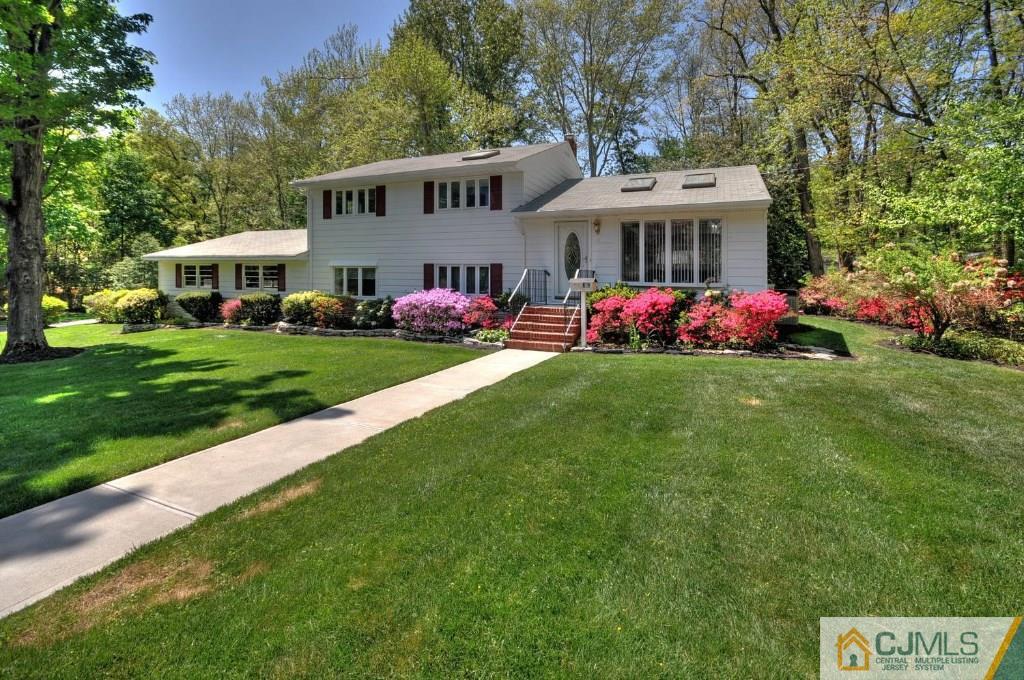 5 Timber Road East Brunswick, NJ 08816 - Photo 1 of 25 a front view of a house with garden and porch