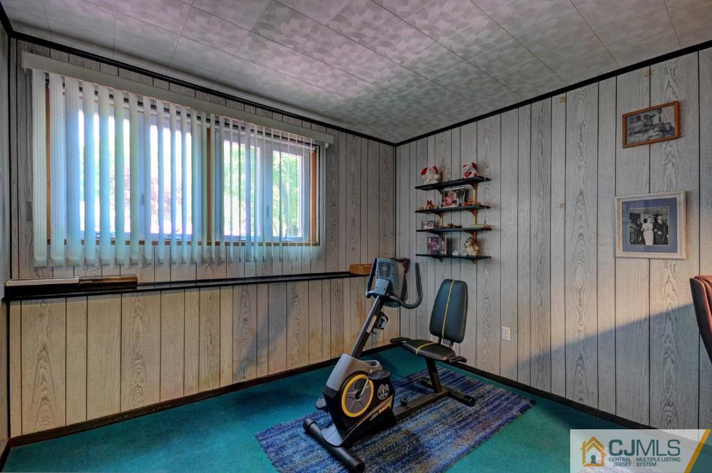 5 Timber Road East Brunswick, NJ 08816 - Photo 12 of 25 a room with gym equipment and a large window