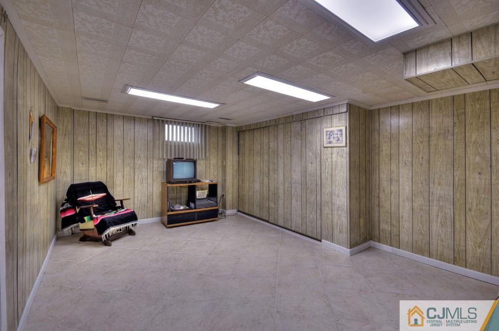 5 Timber Road East Brunswick, NJ 08816 - Photo 15 of 25 a living room with furniture and a flat screen tv