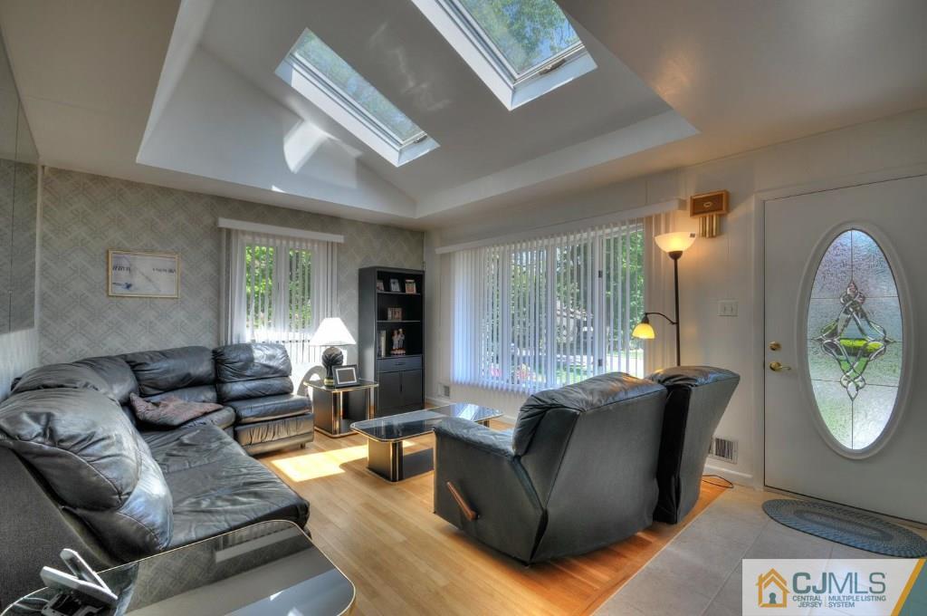 5 Timber Road East Brunswick, NJ 08816 - Photo 3 of 25 a living room with furniture and a window