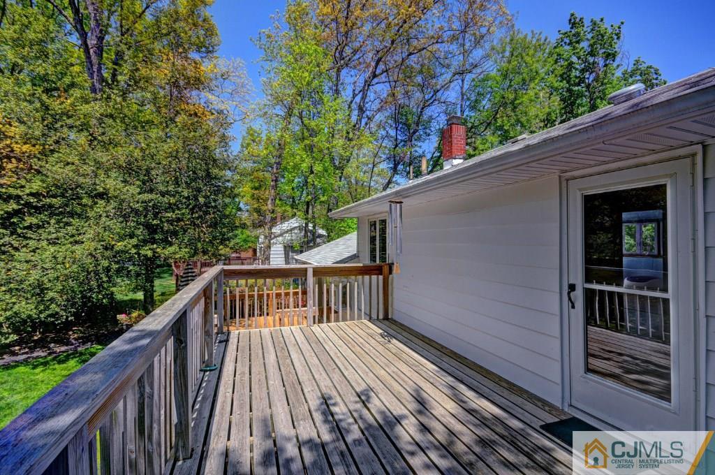5 Timber Road East Brunswick, NJ 08816 - Photo 21 of 25 a view of backyard with a deck and wooden floor