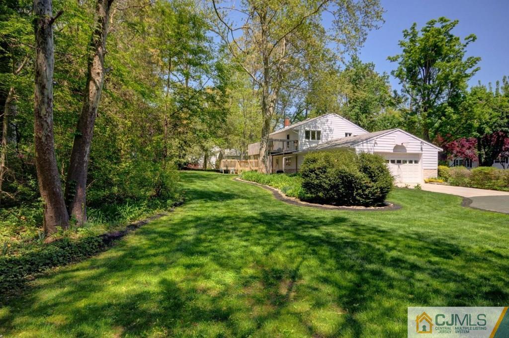 5 Timber Road East Brunswick, NJ 08816 - Photo 23 of 25 a front view of a house with a garden