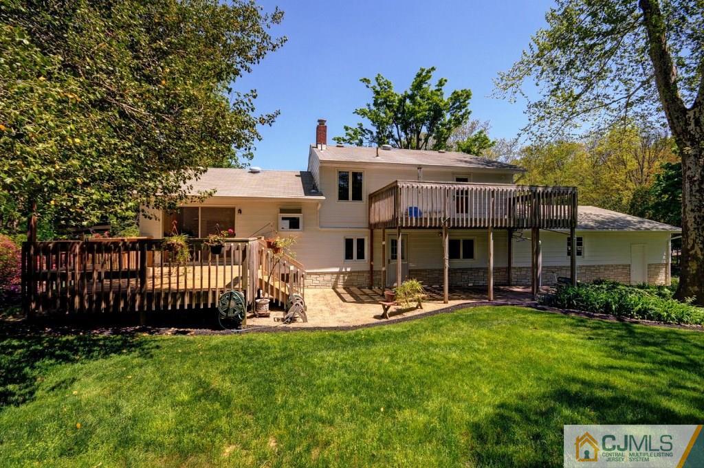 5 Timber Road East Brunswick, NJ 08816 - Photo 25 of 25 a front view of a house with garden and sitting area