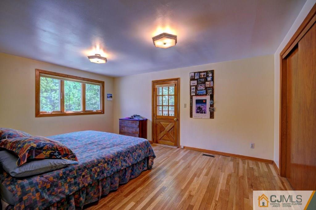 5 Timber Road East Brunswick, NJ 08816 - Photo 9 of 25 a bedroom with a bed and a window
