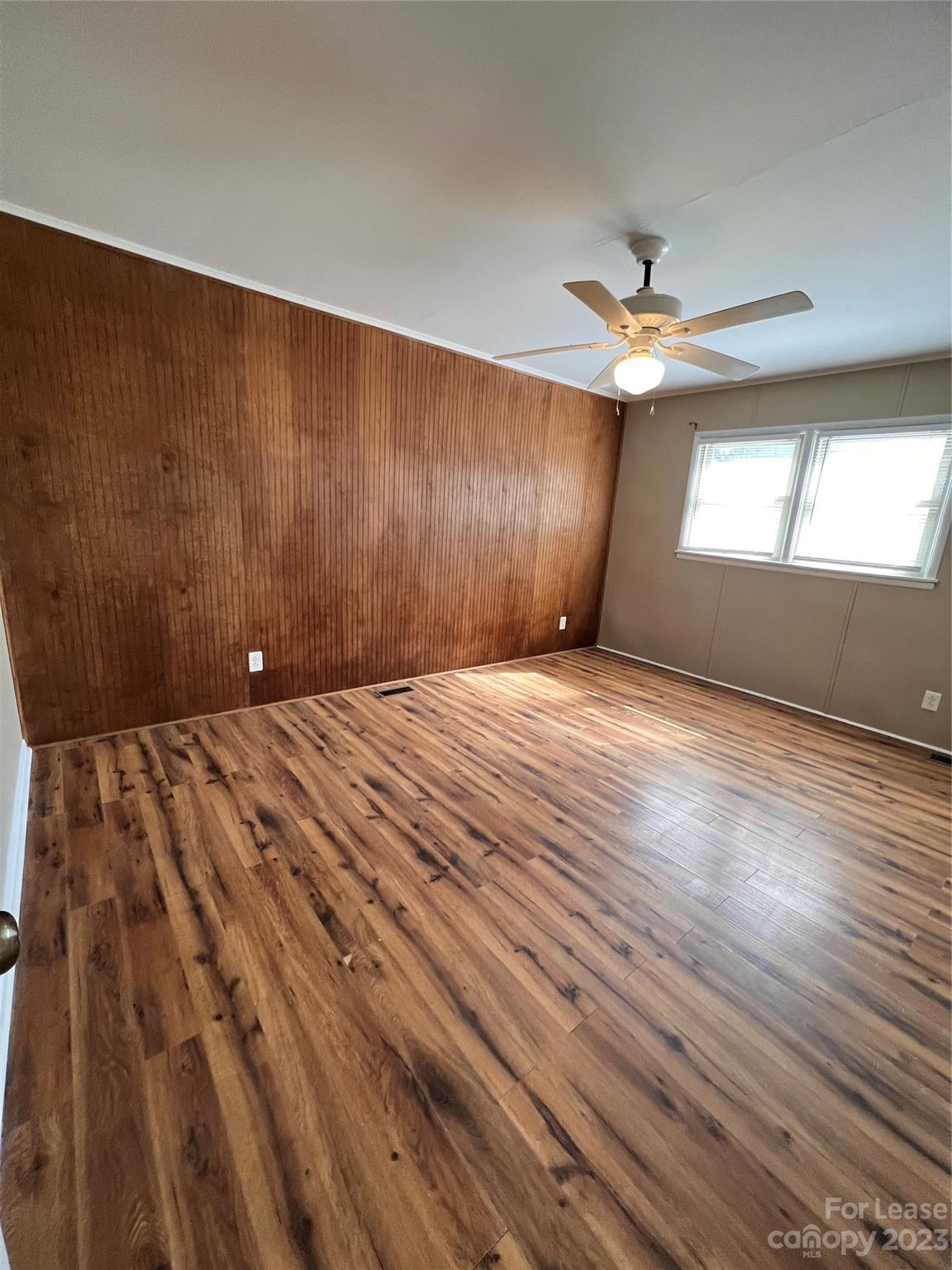 2213 Acme Road Belmont, NC 28012 - Photo 3 of 8 wooden floor in an empty room with a window