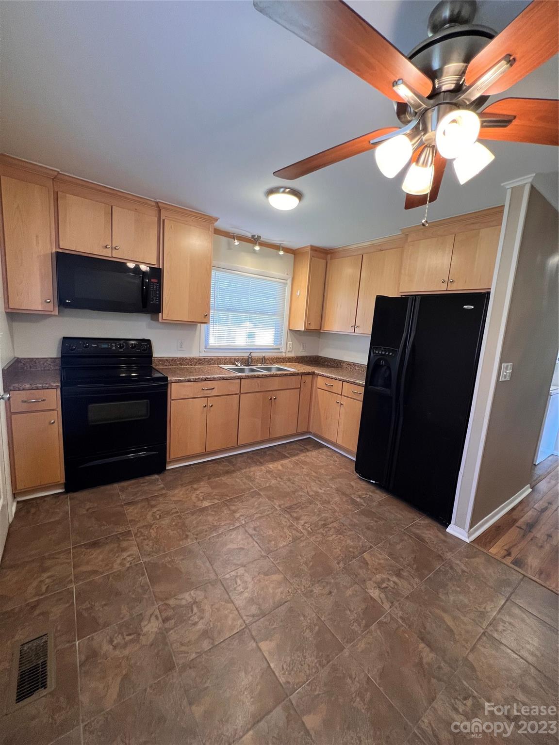2213 Acme Road Belmont, NC 28012 - Photo 8 of 8 a kitchen with stainless steel appliances granite countertop a refrigerator and a sink