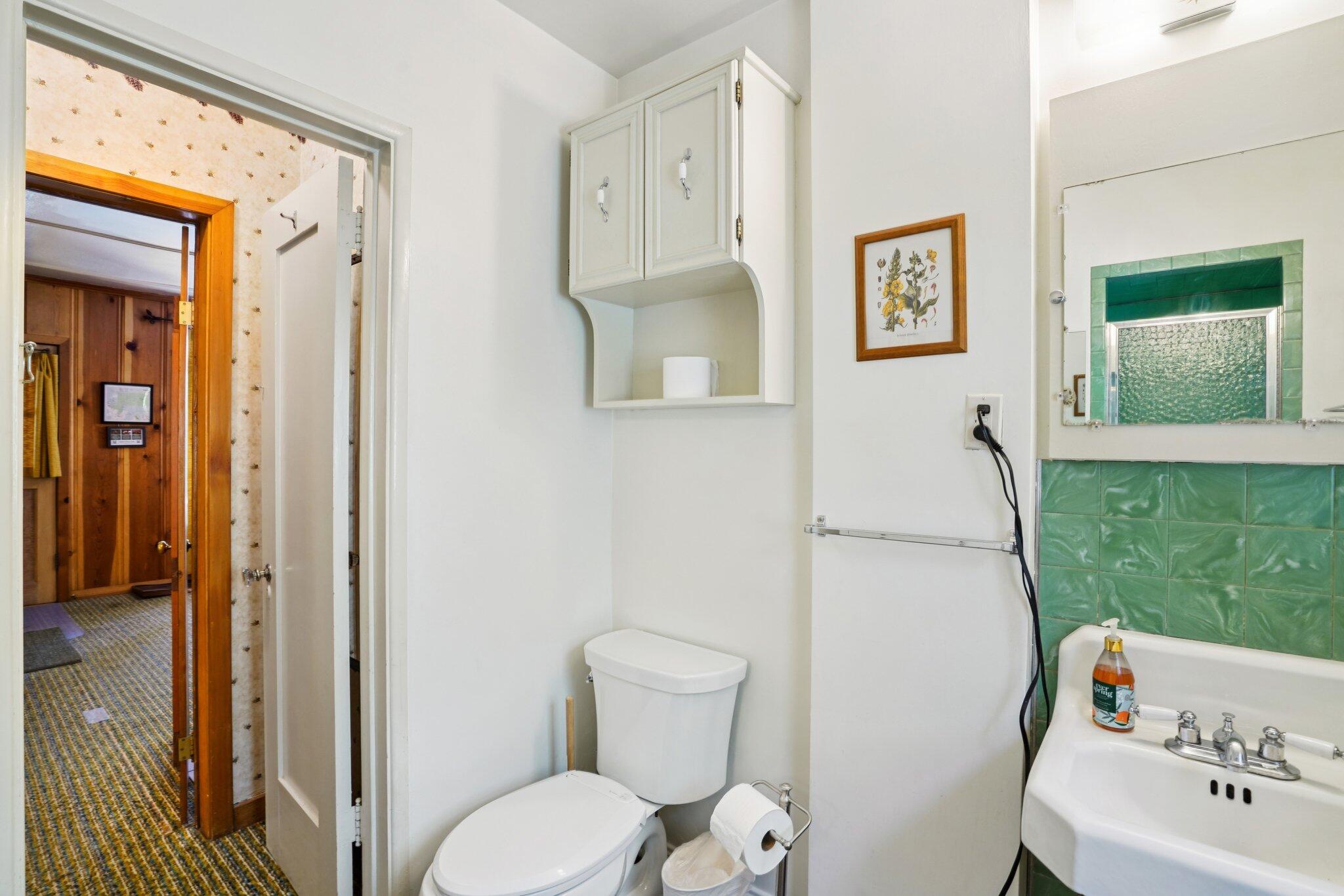 55280 Circle Way Idyllwild, CA 92549 - Photo 18 of 27 a bathroom with a sink toilet and garden view