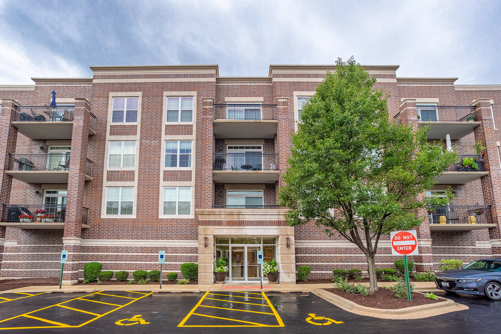50 South Greeley Street, Unit 415 Palatine, IL 60067 - Photo 1 of 21 a front view of a multi story building with yard