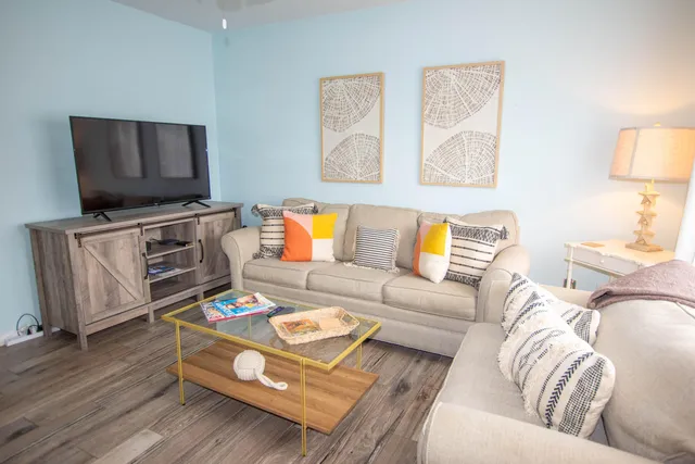 a living room with furniture and a flat screen tv