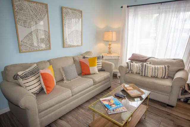 a living room with furniture and a window