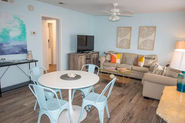 a view of a dining room with furniture and wooden floor