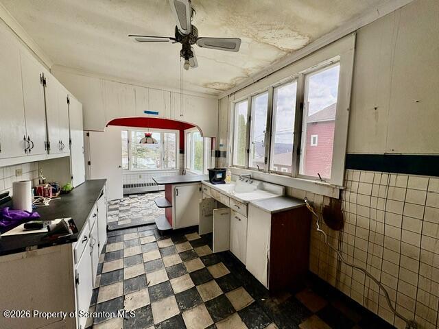 706 Delaware Street Forest City, PA 18421 - Photo 12 of 33 a kitchen with a sink stove and shower