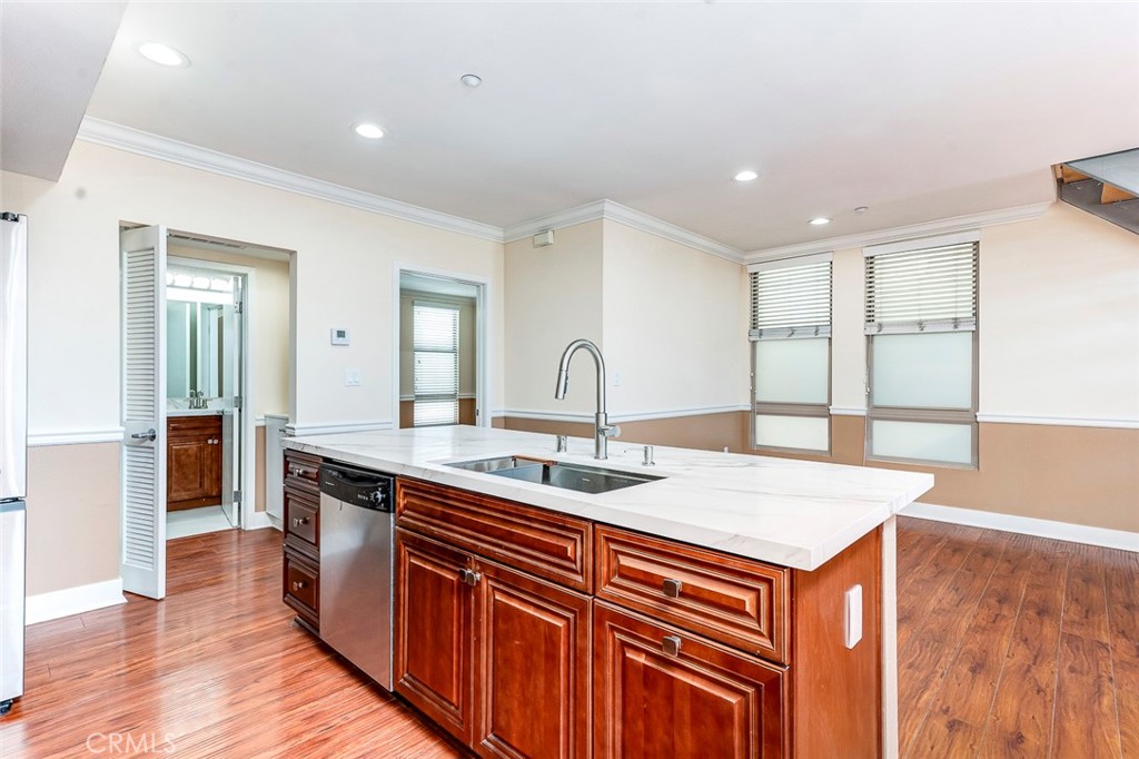 596 South Brea Boulevard Brea, CA 92821 - Photo 18 of 33 a kitchen with a sink and wooden cabinets