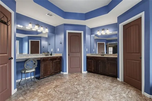 a bedroom with a bed and a ceiling fan