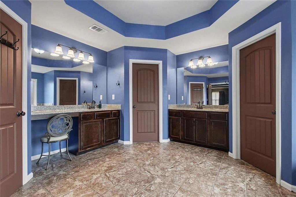 3499 In Bloom Way Auburn, GA 30011 - Photo 19 of 30 a large bathroom with a sink and a mirror