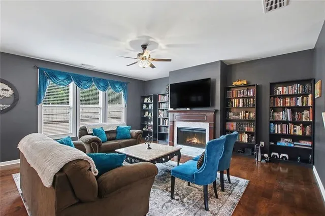 a living room with furniture and a rug