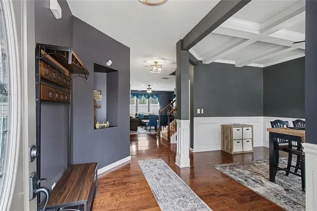 a view of a dining room with furniture window and wooden floor