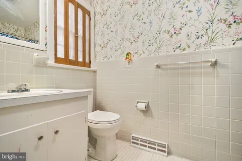 a bathroom with a toilet and a sink