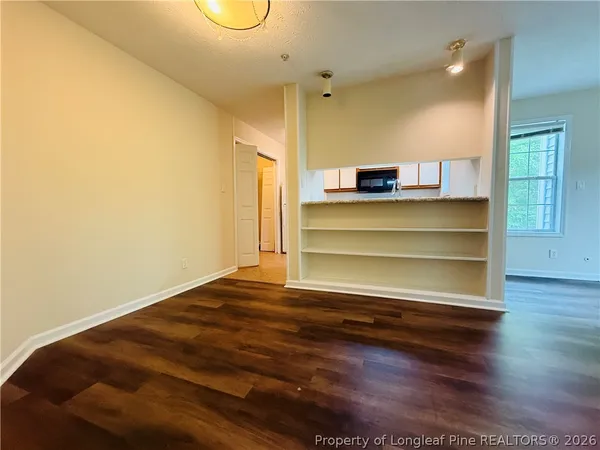 a view of room and wooden floor