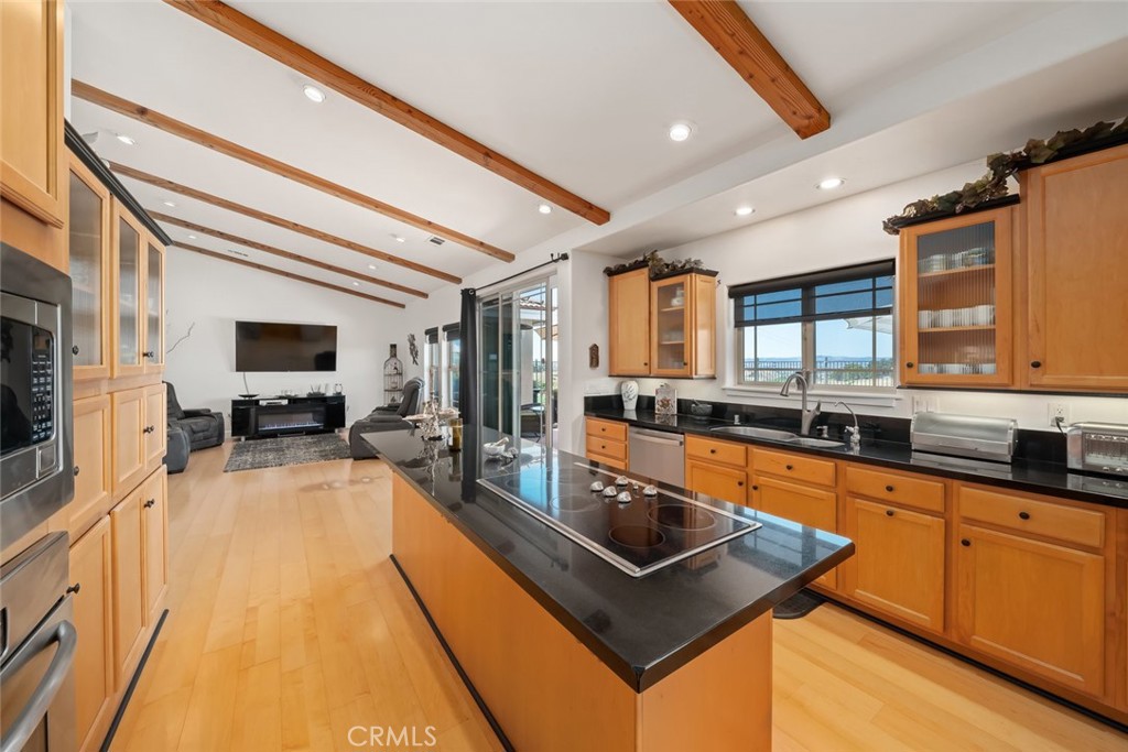 6172 Hawk Ridge Place San Miguel, CA 93451 - Photo 23 of 74 a large kitchen with stainless steel appliances granite countertop a sink and wooden cabinets