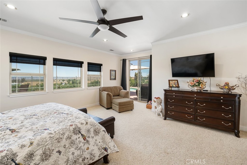 6172 Hawk Ridge Place San Miguel, CA 93451 - Photo 34 of 74 a bedroom with a bed and a flat screen tv