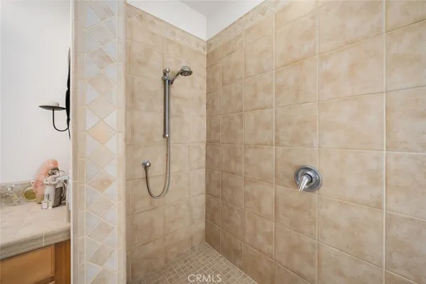 a bathroom with a shower curtain and a window