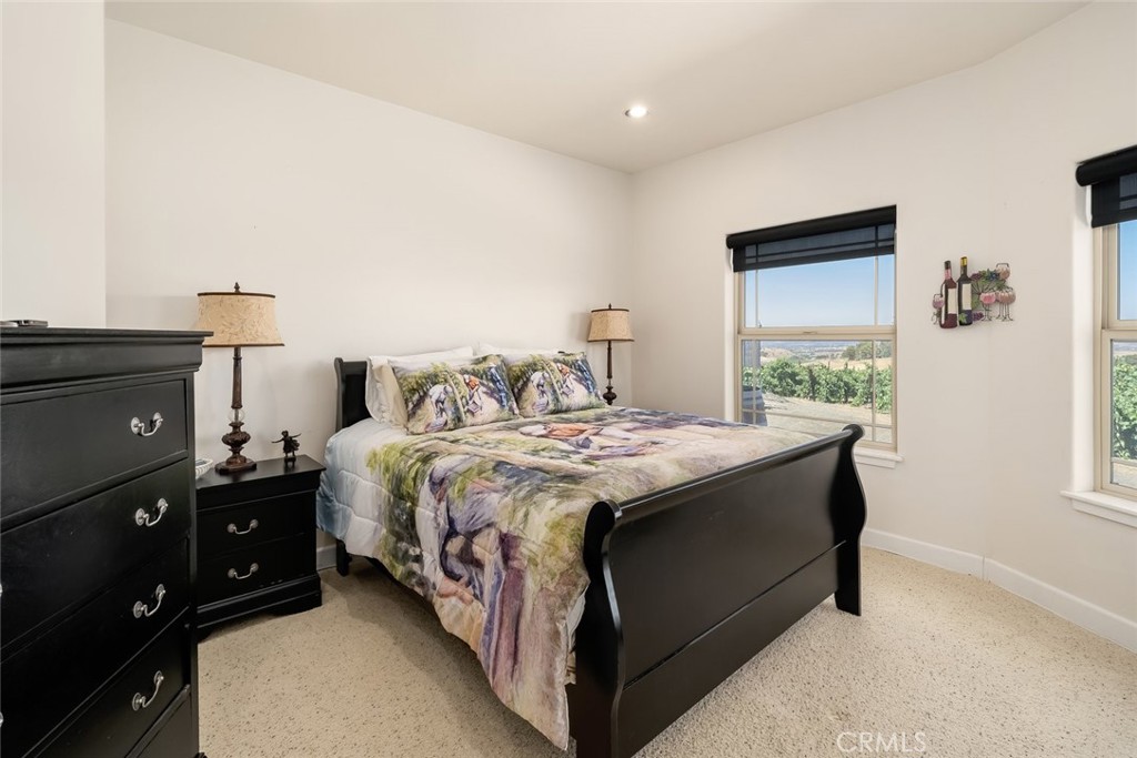 6172 Hawk Ridge Place San Miguel, CA 93451 - Photo 44 of 74 a bedroom with a bed and a tv