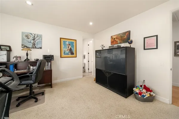 an aerial view of a house with garden space and outdoor seating