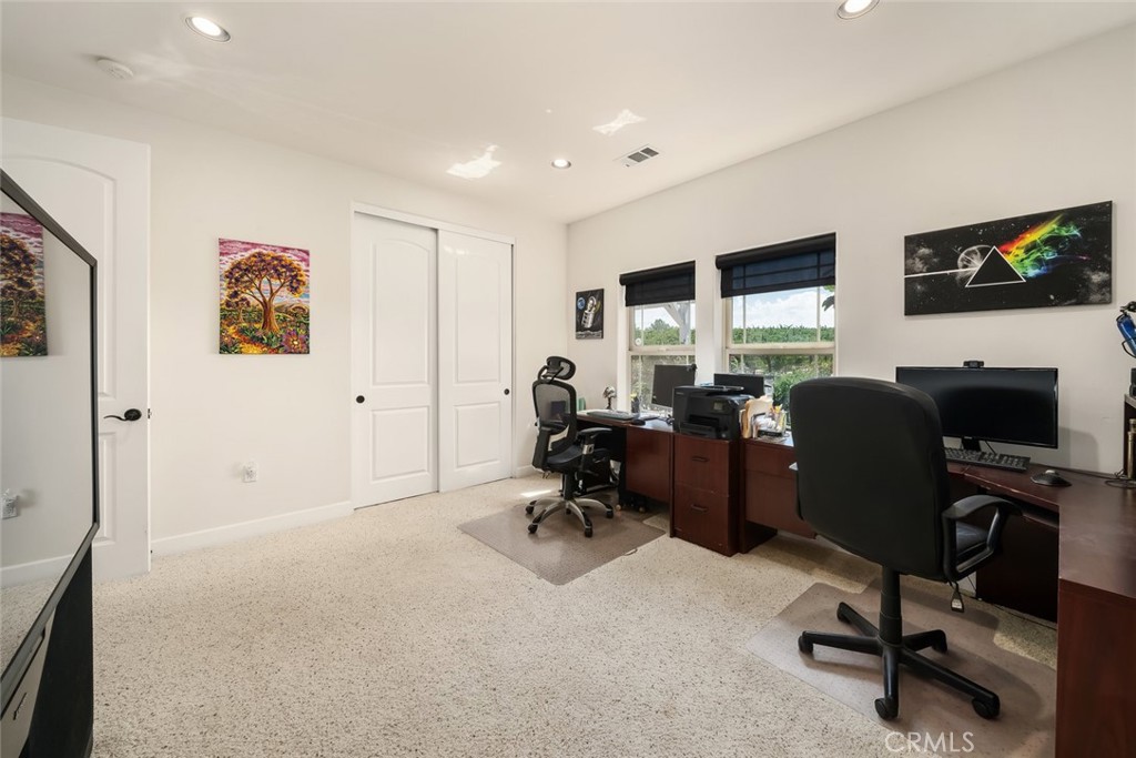 6172 Hawk Ridge Place San Miguel, CA 93451 - Photo 50 of 74 a view of a workspace with furniture and a flat screen tv