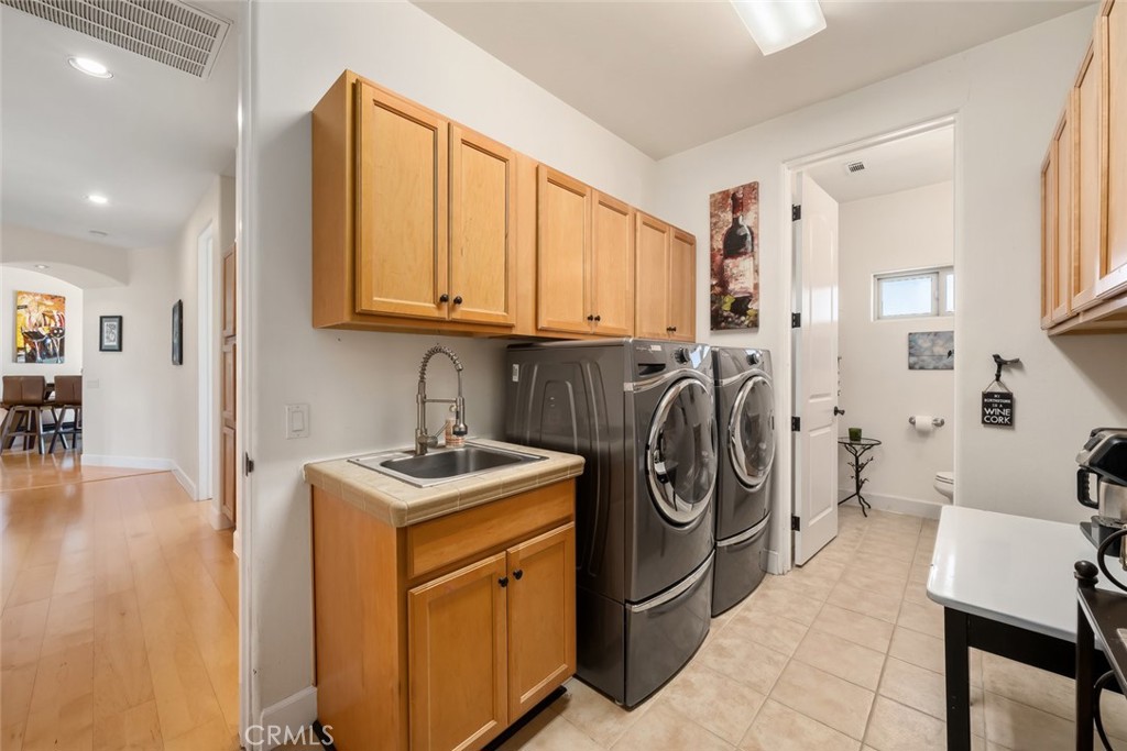 6172 Hawk Ridge Place San Miguel, CA 93451 - Photo 54 of 74 a utility room with sink dryer and washer