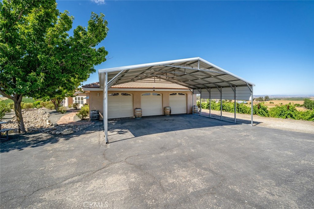 6172 Hawk Ridge Place San Miguel, CA 93451 - Photo 72 of 74 a view of a house with a yard and potted plants