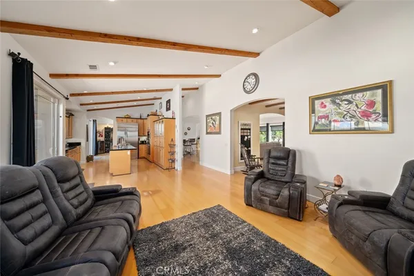 a kitchen with stainless steel appliances kitchen island granite countertop a refrigerator and stove