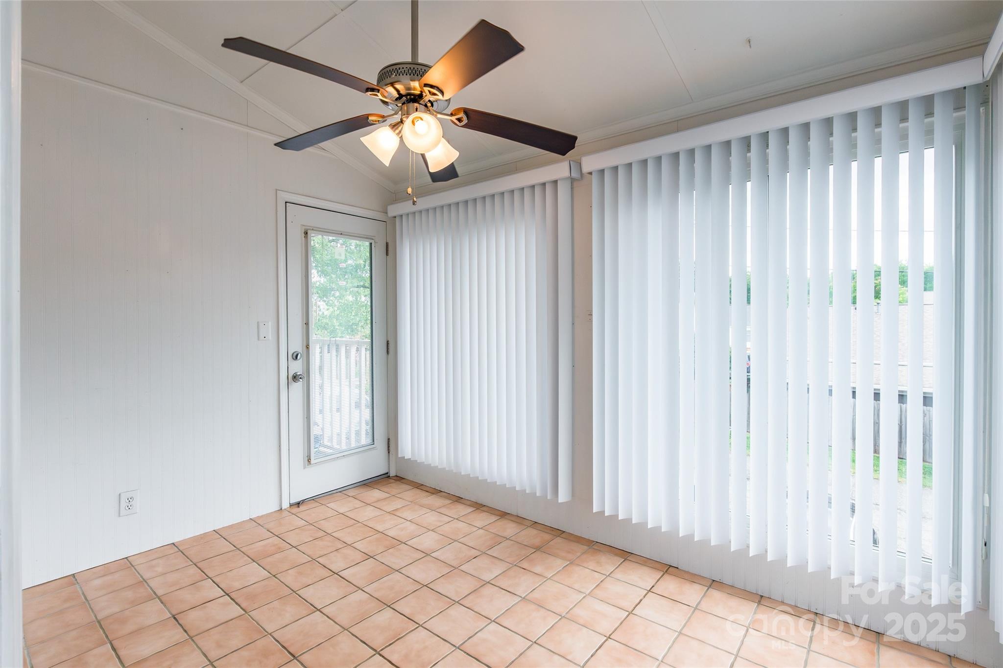 1806 Ebenezer Road, Unit E Rock Hill, SC 29732 - Photo 20 of 23 an empty room with chandelier fan