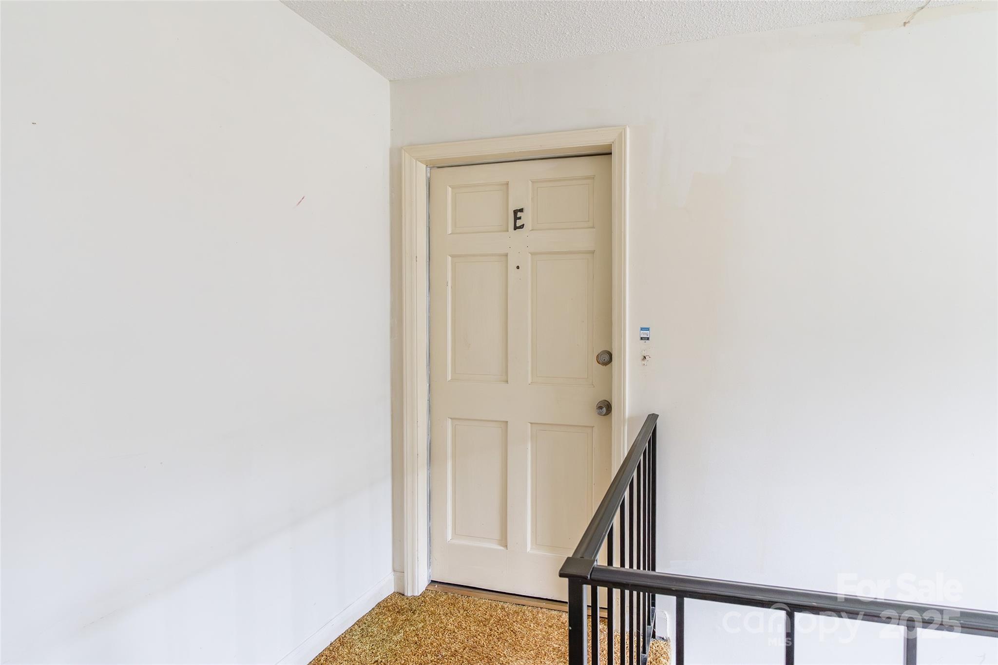 1806 Ebenezer Road, Unit E Rock Hill, SC 29732 - Photo 3 of 23 a view of a hallway with wooden floor and staircase