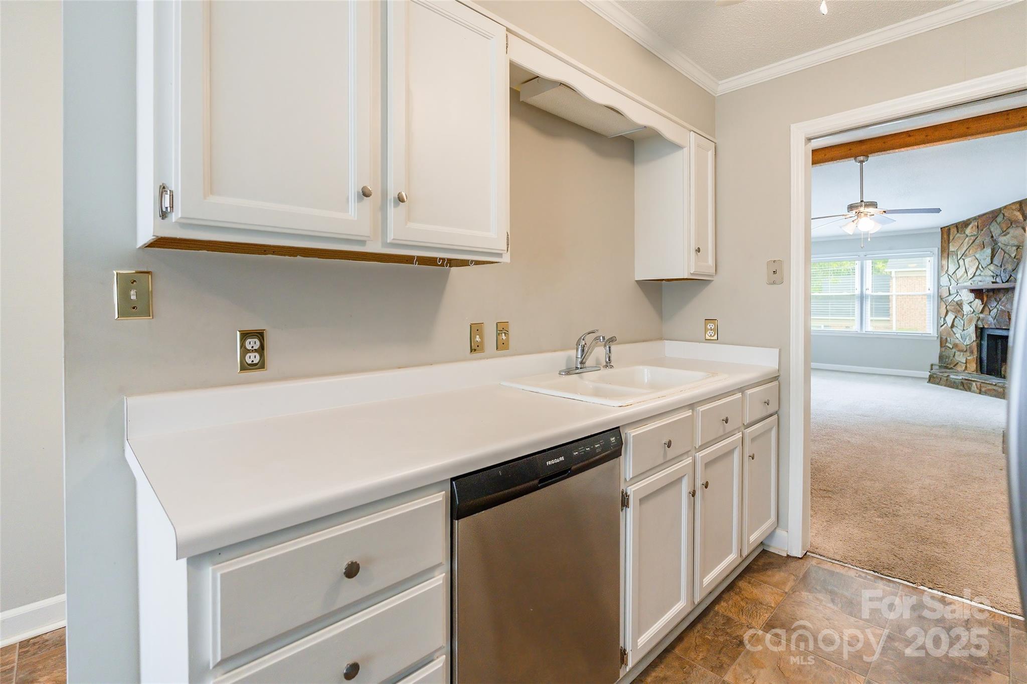 1806 Ebenezer Road, Unit E Rock Hill, SC 29732 - Photo 9 of 23 a utility room with stainless steel appliances granite countertop a sink and dishwasher with white cabinets