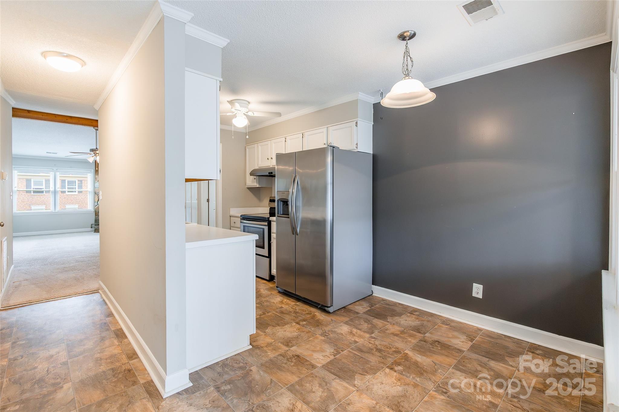 1806 Ebenezer Road, Unit E Rock Hill, SC 29732 - Photo 10 of 23 a view of a kitchen with refrigerator and cabinet