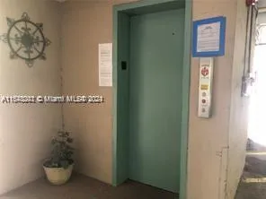 a bathroom with a shower and a window