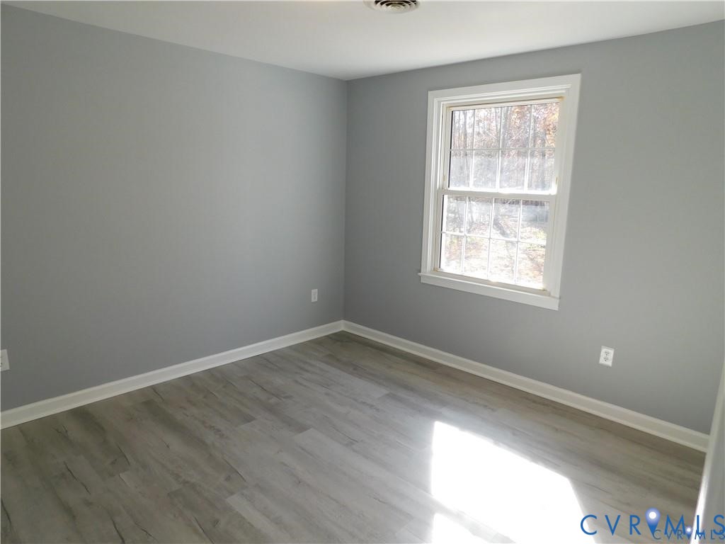1947 Crewsville Road Bumpass, VA 23024 - Photo 18 of 32 2nd bedroom new flooring