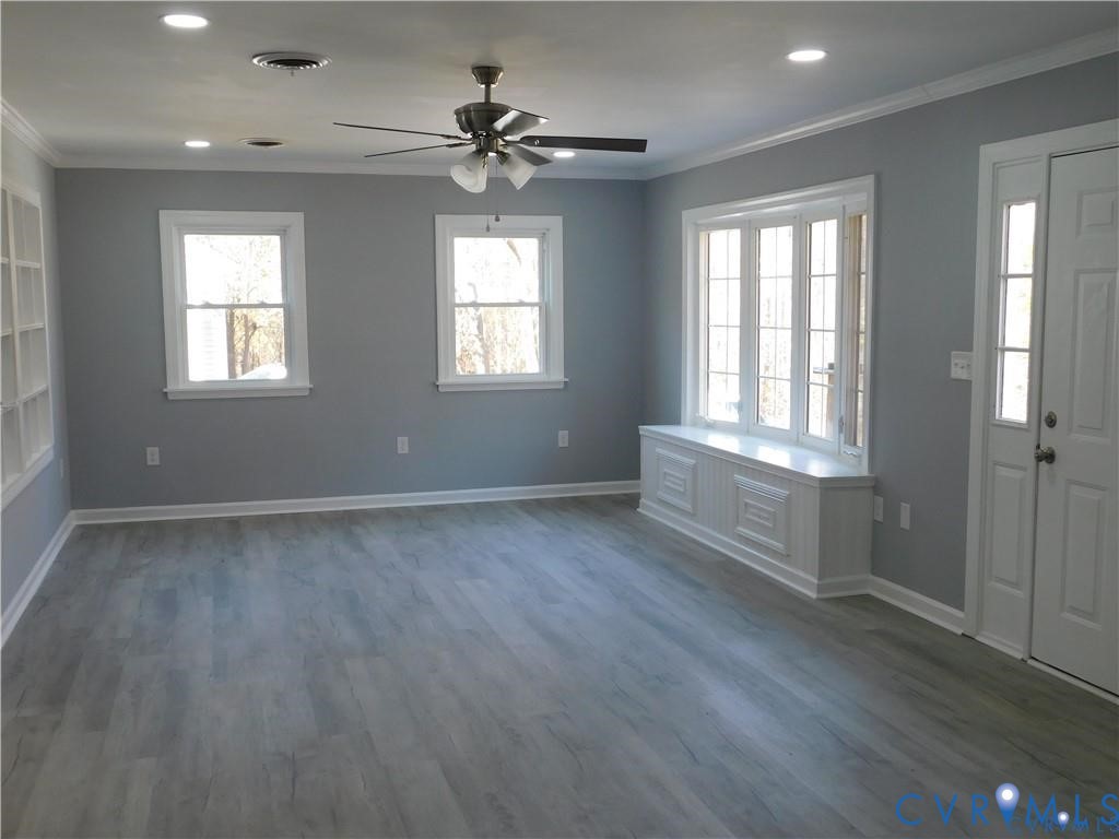 1947 Crewsville Road Bumpass, VA 23024 - Photo 5 of 32 Great room with ceiling fan and window seat
